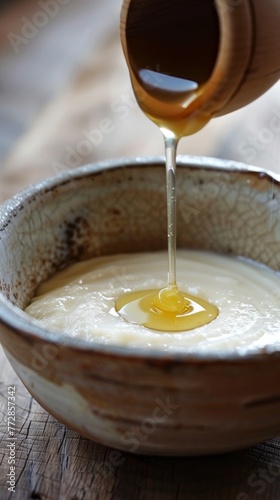 Pouring honey into a bowl of yogurt