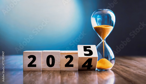 Flipping block 2024 to 2025 text with hourglass on table. Resolution, time, plan, goal, motivation, reboot, countdown and New Year holiday concepts