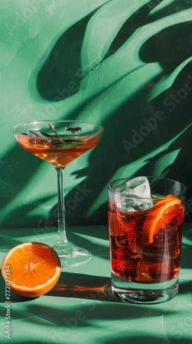 A studio image with a green background of a Negroni cocktail