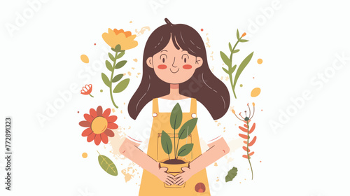 A girl in her hands with a seedling a flower a plant.