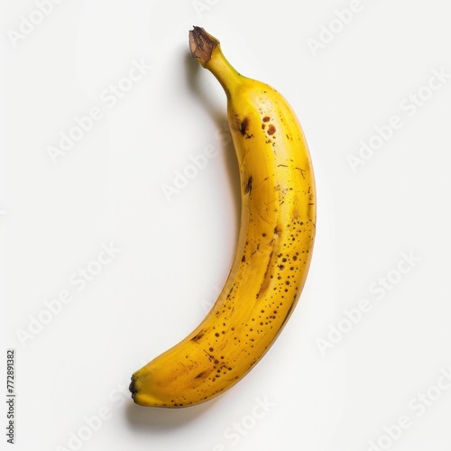 A banana, a fruit isolated on a white backdrop (ID: 772891382)