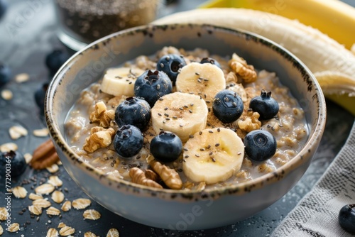 Oatmeal with bananas, blueberries, walnuts, and chia seeds.