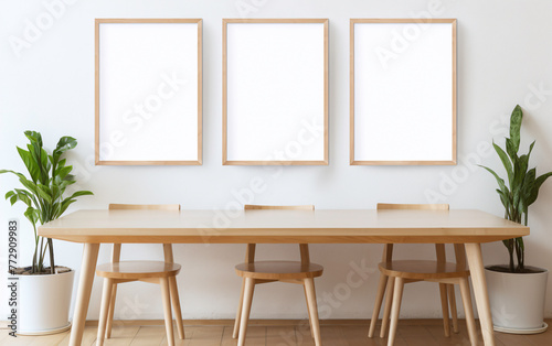 a table and chairs with a white frame on the wall