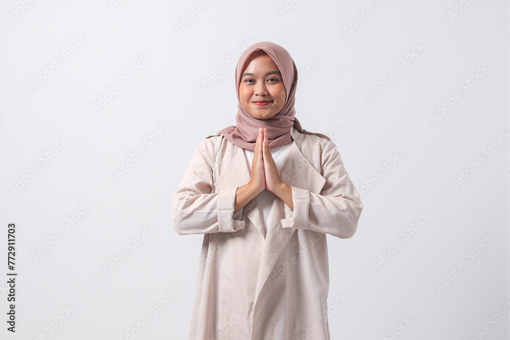 Portrait of excited Asian hijab woman in casual suit showing apologize ...