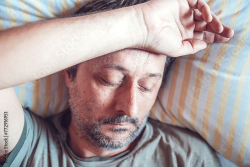 Billede på lærred Morning depression, man waking up in low mood, feeling sad, anxious, and lacking interest in anything