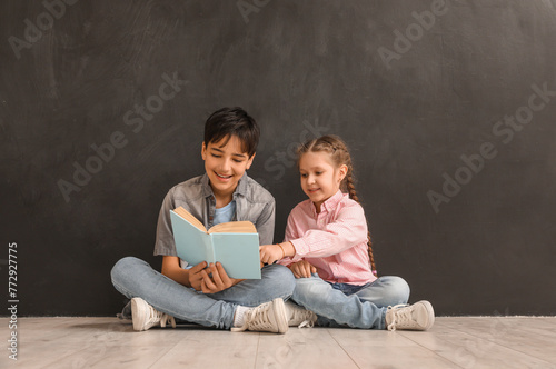 Little children reading boo...