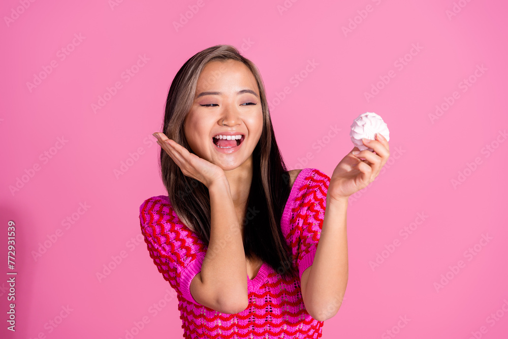 Photo of excited funky lady dressed knitted shirt enjoying eat zephyr isolated pink color background Photo of excited funky lady dressed knitted shirt enjoying eat zephyr isolated pink color background
