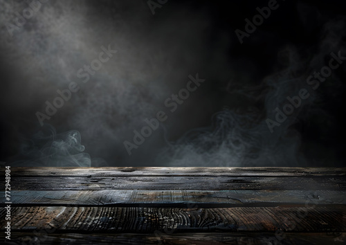 Empty wooden table top with blurred dark background for product display presentation.