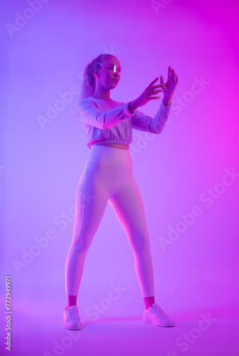 Futuristic Woman with Holographic Glasses in Neon Lights