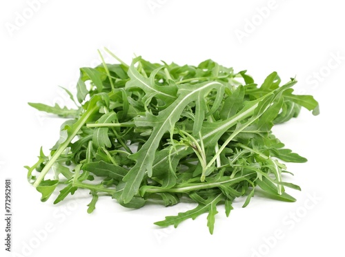 Heap of rocket salad  leaves on white background.