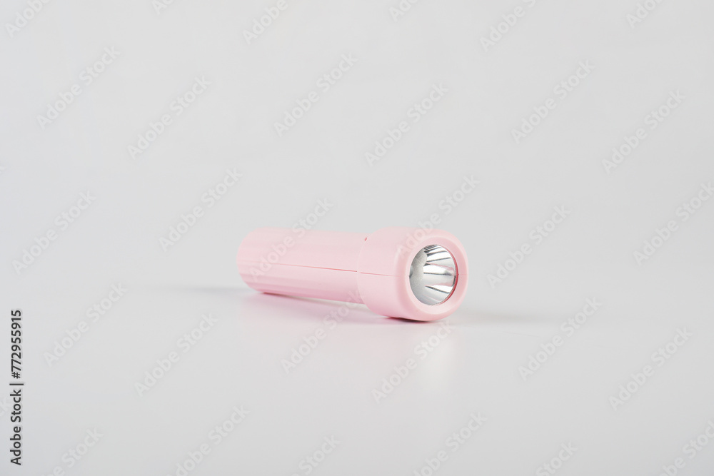 Pink electric LED torch flashlight isolated on a white background Pink electric LED torch flashlight isolated on a white background