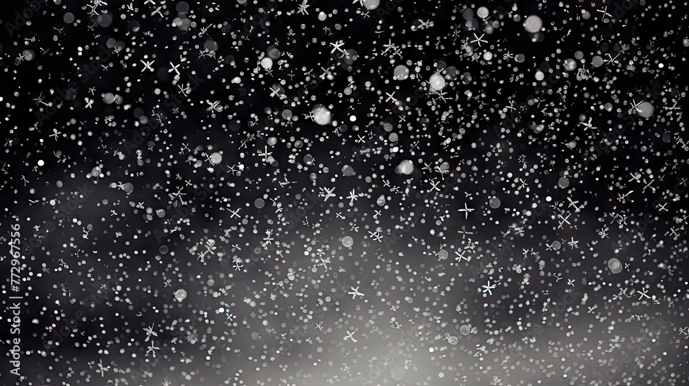 Fototapeta premium Snow falling in darkness with a white snowflake