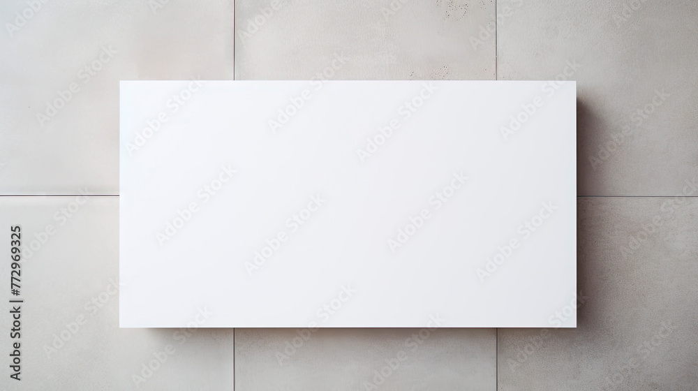 Blank square sign on concrete wall, white poster mockups with shadow on grey background Blank square sign on concrete wall, white poster mockups with shadow on grey background