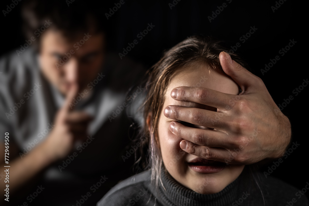 Child, domestic violence and depression with hand on mouth for silence, abuse and sad in relationship.