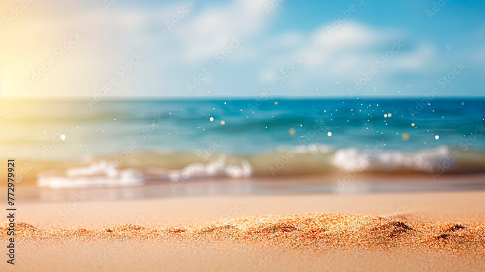 Bright sun shining over sandy beach with waves