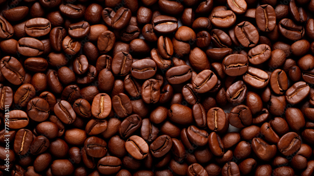Obraz premium A heap of coffee beans close-up with numerous beans