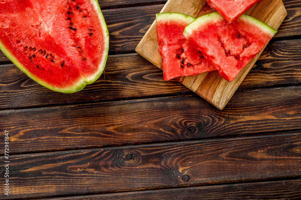 Fresh watermelon on wooden background top view copyspace