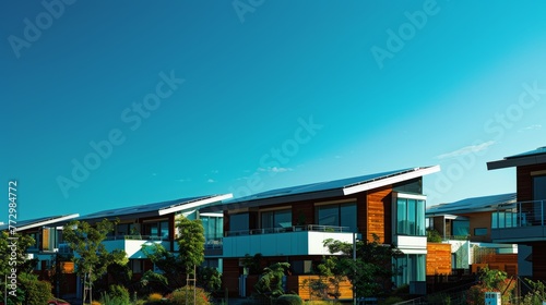 Modern residential buildings with clear blue sky © iVGraphic