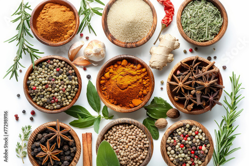 A variety of spices are displayed in wooden bowls on a white background. The spices include cinnamon, cumin, and pepper. herbs and spices, white background
