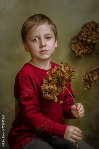 Portrait of a handsome boy in retro style. Creative  fabulous photo processing. The concept of the book cover.