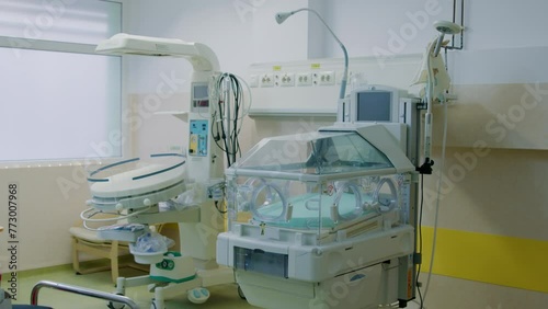 Hospital's neonatal facility row of incubators stands ready to nurture prematurely born babies. Amidst quiet hum of medical equipment dedicated team of healthcare professionals works tirelessly. photo
