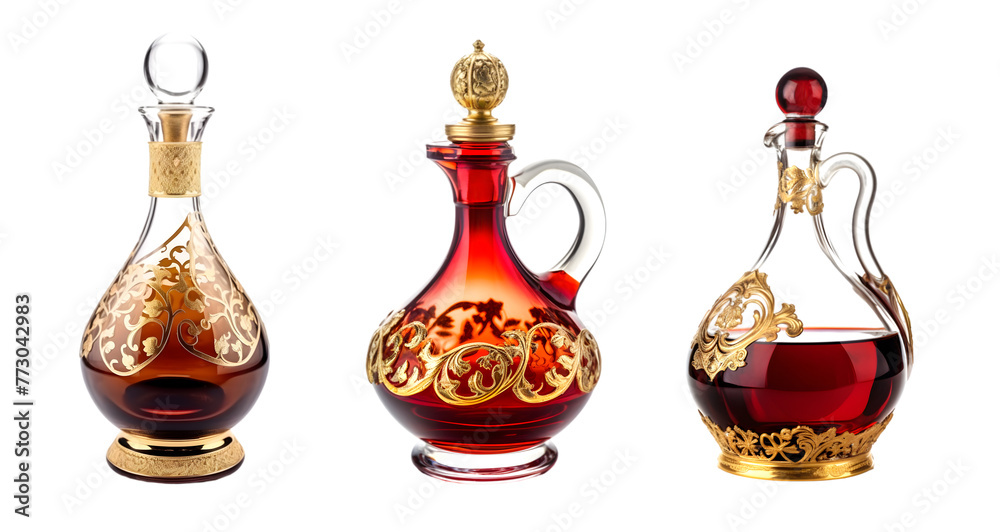 Beautiful Art Nouveau glass decanter made of red glass with gold decorations. Set of decorative glass carafes on the white background. Beautiful Art Nouveau glass decanter made of red glass with gold decorations. Set of decorative glass carafes on the white background.