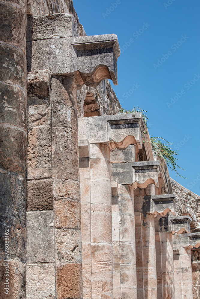 Aspendos, Antalya region, Turkey (Turkiye). Closu up fragment of columned gallery above the auditorium-theatre in the Ancient Roman Theater of Aspendos. Vertical shot