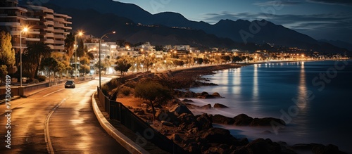 beautiful Albir town with main boulevard promenade, seaside beach and Mediterranean sea