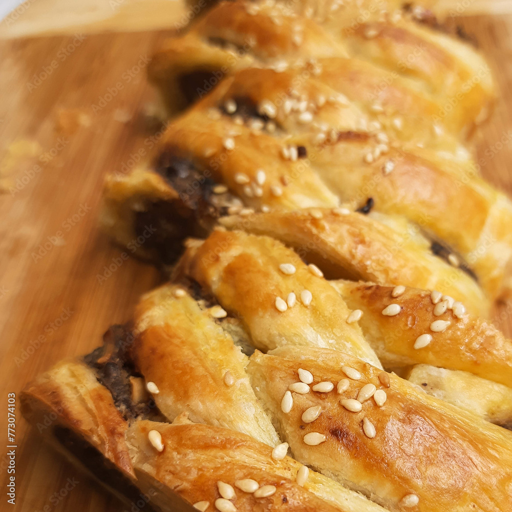 Slice of Banana strudel, famous for its crunchy, in a box, ready to serve.	