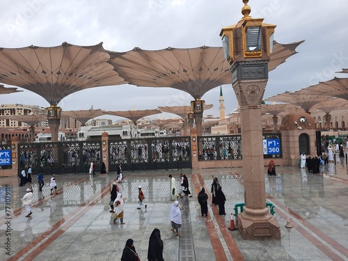 Beautiful daytime outdoor view of Masjid Al Nabawi Madinah in dark clouds and rain.