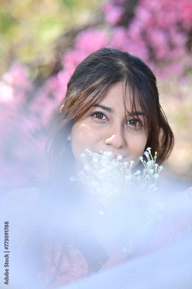 portrait of a woman with flowers. Flowers and beautiful woman. garden. spring time. happiness and freshness. 