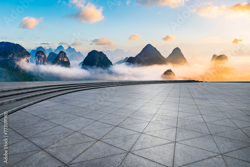 Empty square floor and beautiful mountain with clouds natural landscape at sunrise © ABCDstock