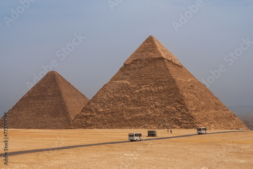 Giza Pyramid Complex is complex of ancient monuments on Giza Plateau. Pyramids of Khafre  Khafre  and Mikerin  Menkaure  against blue sky background.  Cairo  Egypt - April 18  2008