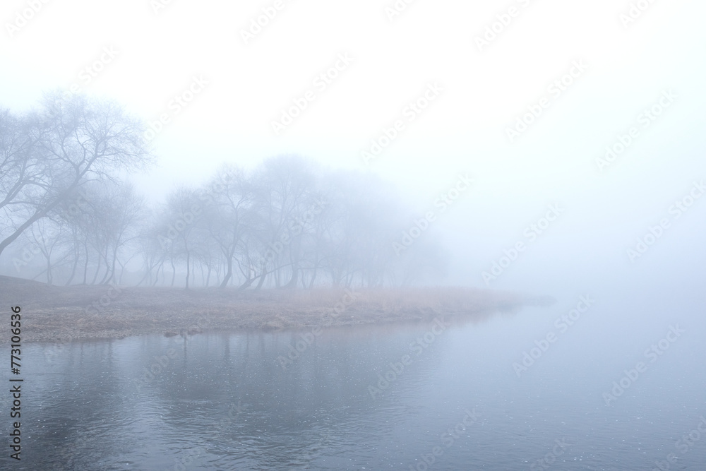 Spring morning landscape. Fogy and misty rises from the meadows and river.