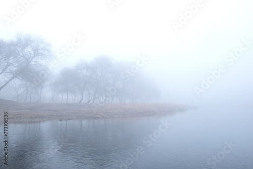 Spring morning landscape. Fogy and misty rises from the meadows and river.