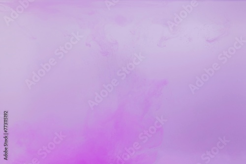 Purple color dye melt on white background,Abstract smoke pattern,Colored liquid dye,Splash paint
