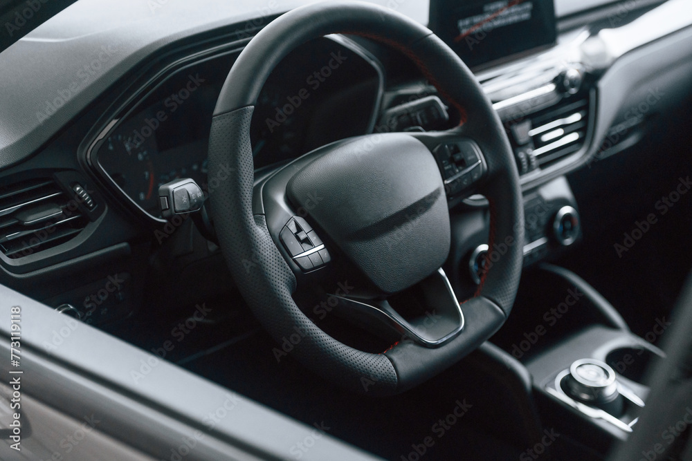 View of the steering wheel and interior in modern car