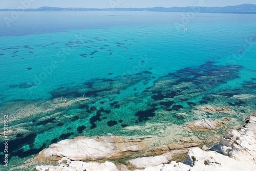 Stunning view of a brilliant blue lagoon surrounded by a sandy shoreline