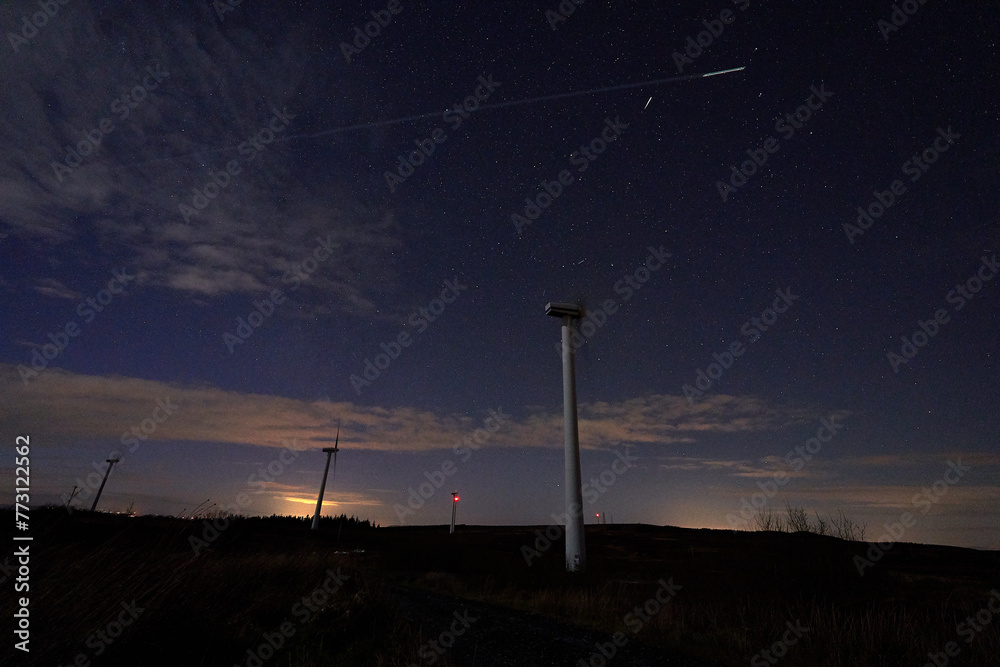 Fototapeta premium Night sky landscape wind turbine