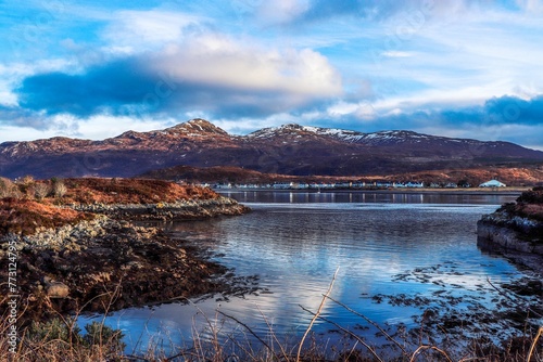 Aerial view of tranquil blue water and snowy mountains in Kyle of Lochalsh, Scotland, UK photo