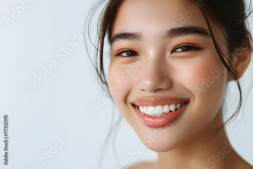 Closeup Beautiful smiling asian young woman with smooth healthy skin isolated on white background