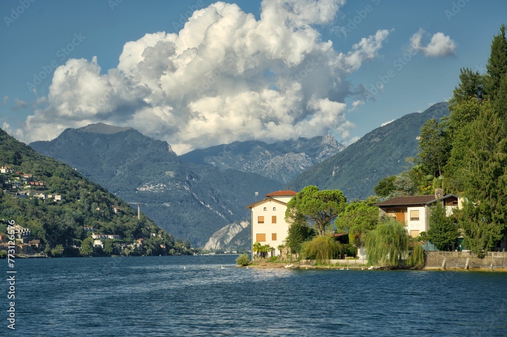 Aerial view of Lake Lugano in Switzerland, surrounded by lush green mountains Aerial view of Lake Lugano in Switzerland, surrounded by lush green mountains