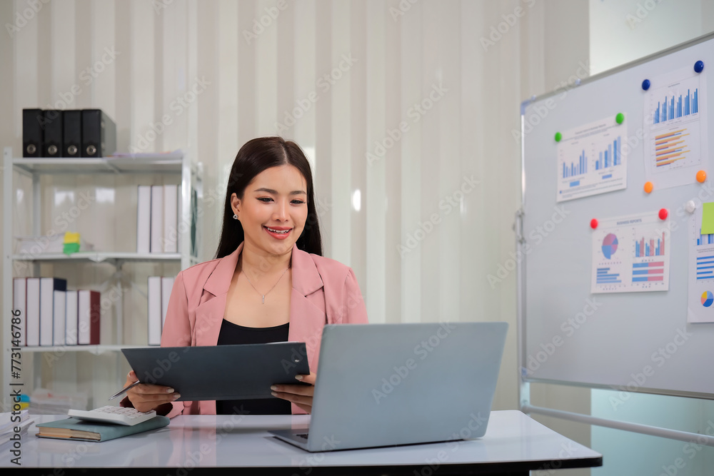 Business accounting woman counting on calculator working on financial document in hands closeup. Bookkeeping concept Business accounting woman counting on calculator working on financial document in hands closeup. Bookkeeping concept
