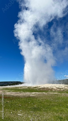 Majestic geyser spewing steam and hot water into the air in the US