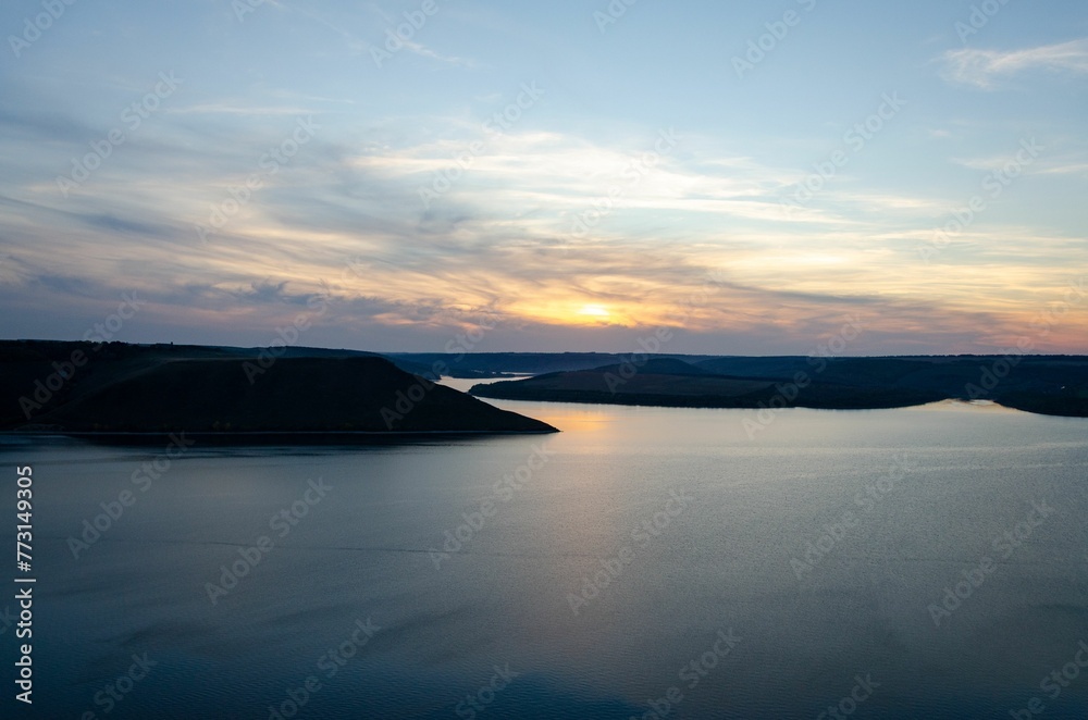 Beautiful landscape of tranquil blue lake at vibrant beautiful dusk