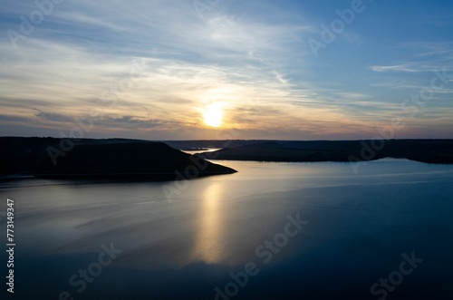 Beautiful landscape of tranquil blue lake at vibrant beautiful dusk