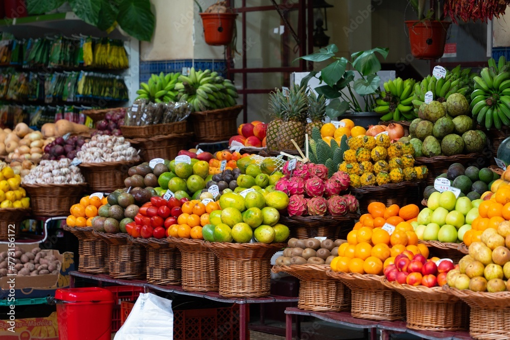 fruits are in baskets and stacked next to each other at an outdoor market