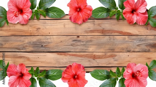   A wooden plank is topped with red flowers and green leaves Below, surrounds a border of intermixed red flowers and green leaves
