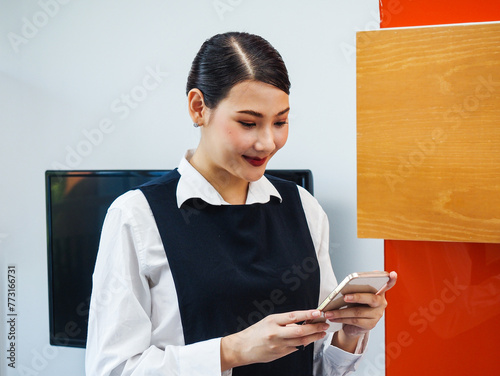 A beautiful Asian woman in uniform