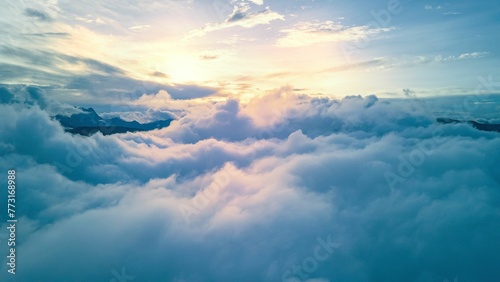 Aerial shot of clouds over the mountains in Yunnan province, China. © Wirestock